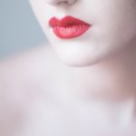 woman with orange lipsticks