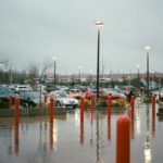 a parking lot filled with lots of parked cars